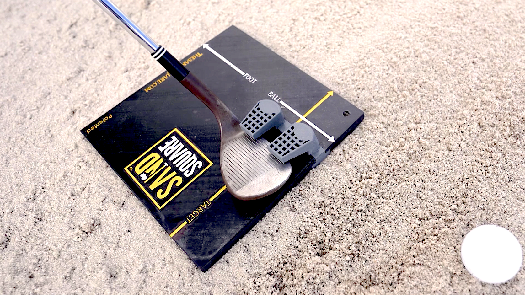 The 60 degree sand wedge in a training aid called The Sand Square. Practice your sand shot at public golf courses near me or wherever you can find a good practice area.